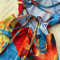 French-inspired, subtly sexy, open-back camisole dress with ruched waist, figure-flattering silhouette, and printed design – perfect for a vacation getaway