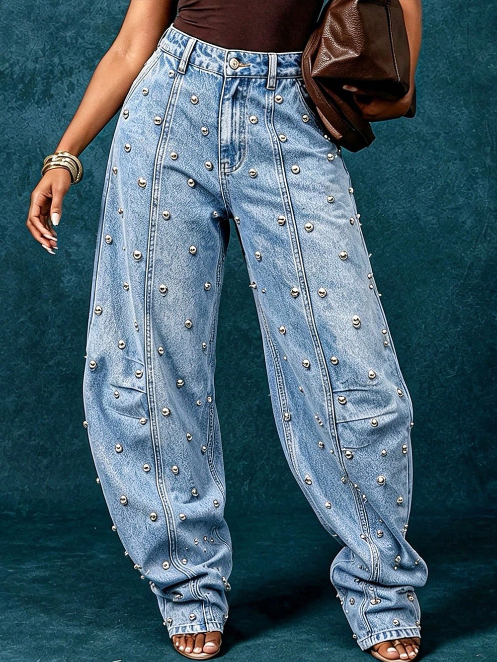 European and american style women's washed denim jeans with metal rivet embellishments, high waist, split seam detail, relaxed fit, and wide leg design