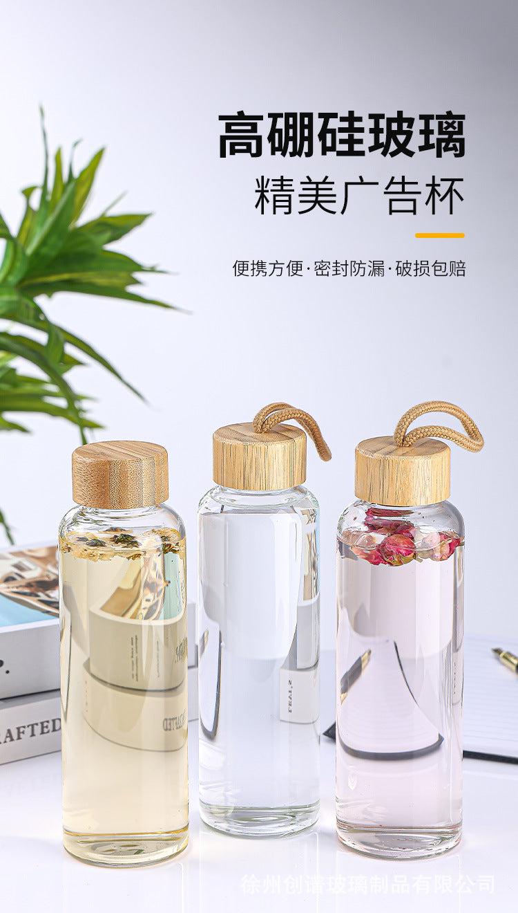 Cross-border 16oz bamboo cover with lifting rope heat-resistant silicone sleeve transparent single-layer borosilicate glass water cup printing logo