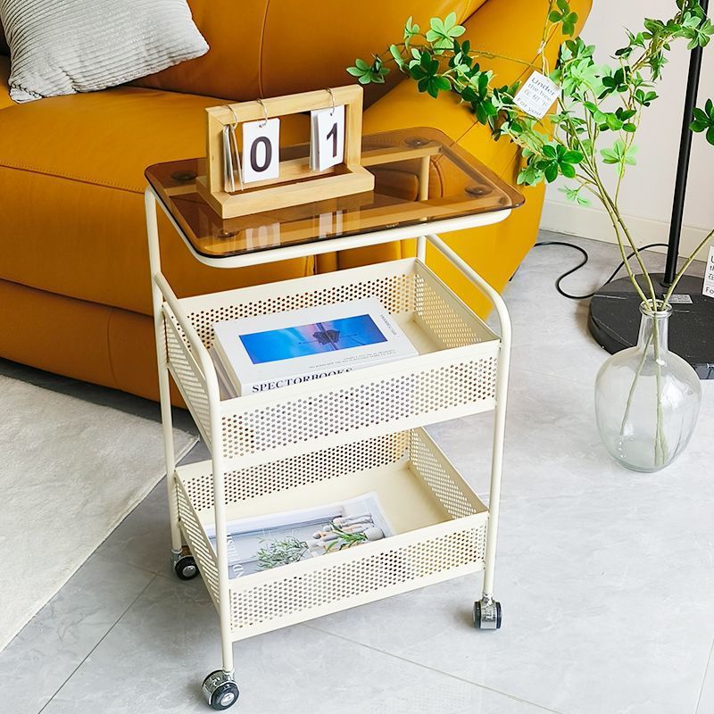 Cream style living room sofa next to several popular snacks multi-layer storage rack bedroom bedside table storage rack trolley