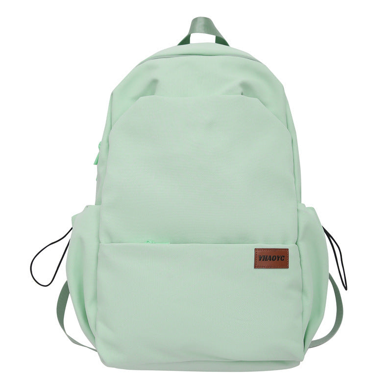 New solid color junior high school student large-capacity backpack male backpack schoolbag male college student business travel backpack