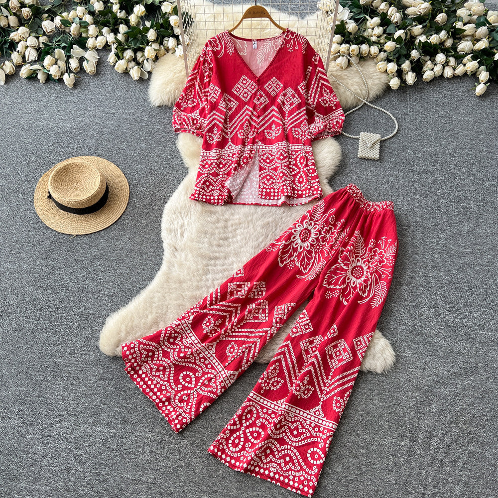Vacation-ready green floral print two-piece set for women. summer v-neck, slimming wide-leg pants, perfect for both work and play. a stylish and chic outfit