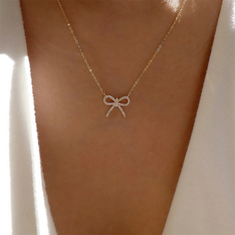 Customized necklaces: european and american cross-border jewelry, minimalist fashion bow pendant, women's zinc alloy diamond-studded necklace