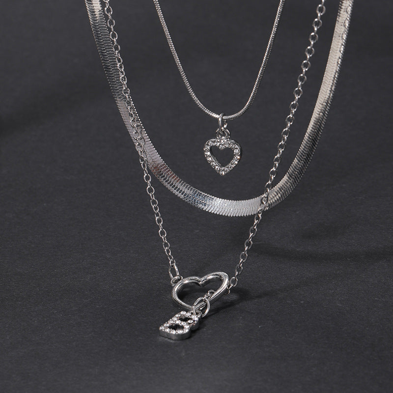Wholesale alloy diamond-studded letter pendants, european and american cross-border jewelry, multi-layered fashion design heart necklaces for women