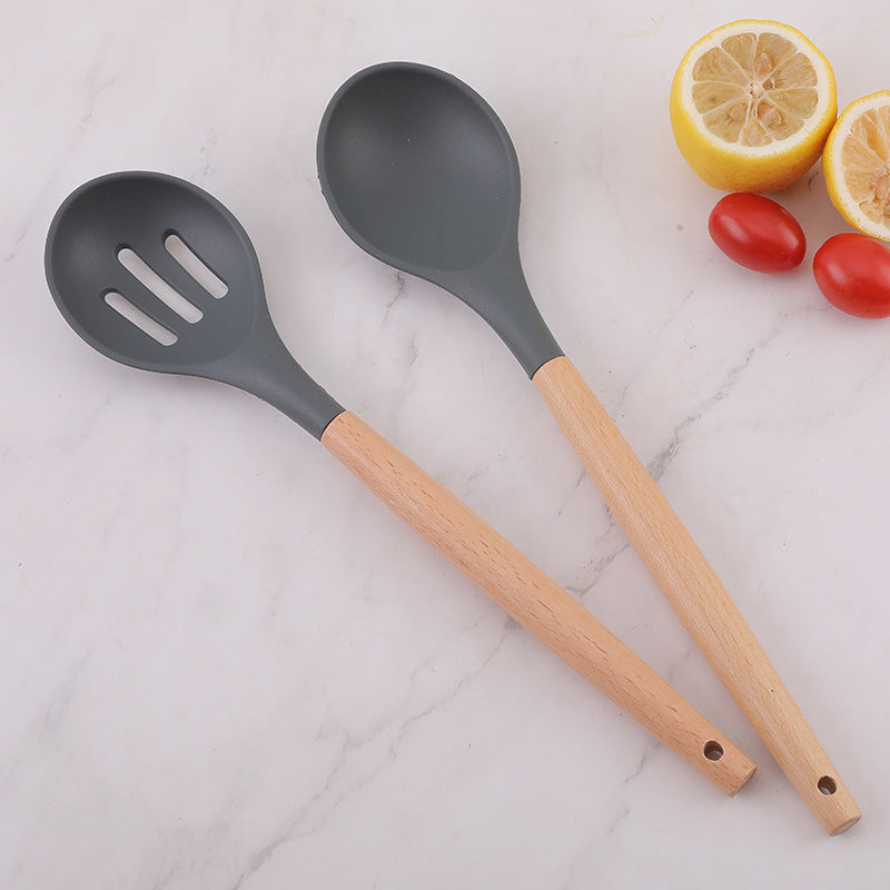 Food grade silicone non-stick pan is denser and more leak-resistant to high temperature. Household wooden handle, dense spoon, colander, kitchen cooking tools
