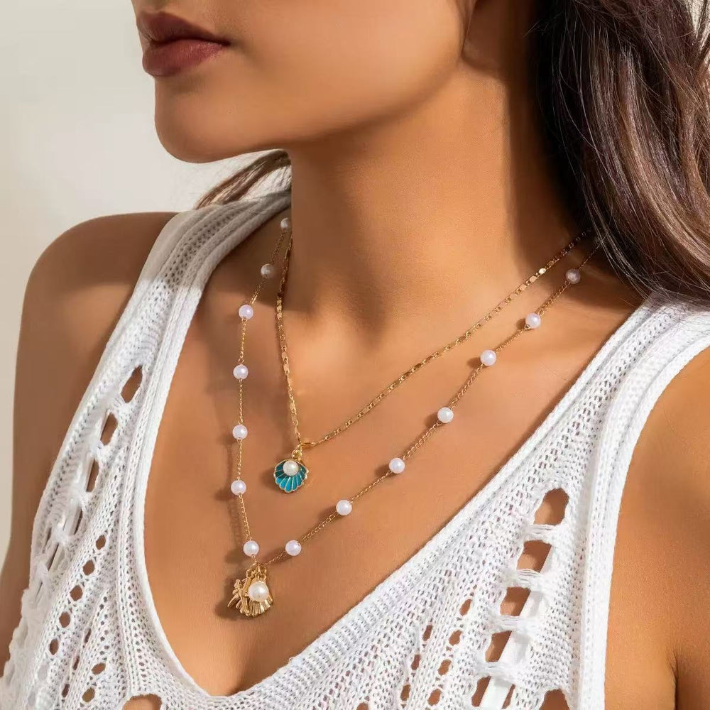 European and american cross-border jewelry: ocean-themed metal starfish and seashell necklace set with designer faux pearl chain