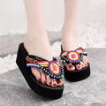 Black flip flops with happy bells