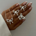 European and american cross-border ins style high-end bow pendant necklace for women, elegant and versatile minimalist earrings and rings jewelry set