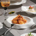 Minimalist pure white ceramic dinnerware set for home, restaurant, and hotel use - porcelain plates, creative plating, and dessert bowls