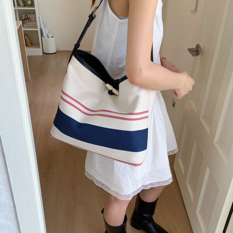 Cross-border striped canvas bag women's large capacity 2025 new summer versatile shoulder messenger bag college student tote bag