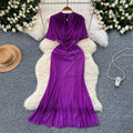 Elegant and alluring, this high-end, figure-hugging, mid-length mermaid gown features a plunging neckline, short sleeves, hot-fix rhinestone embellishments, and a daring slit. perfect for the sophisticated woman