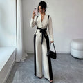 minimalist color block two-piece set: v-neck, tie-waist jacket with black and white wide-leg pants