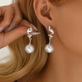 European and american cross-border fashionable and versatile faux pearl earrings for women - light luxury, high-end, floral, teardrop, and trendy ins style stud earrings