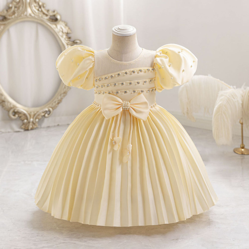 Ready-to-ship wholesale toddler evening gowns, fabric bows, princess dresses, piano recital dresses, and baby dresses