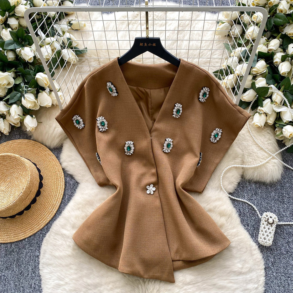 Elegant chanel-inspired, high-end, meticulously crafted, diamond-studded v-neck, short-sleeved, waist-cinching jacket for women. a chic and sophisticated french-style blazer vest, perfect for winter