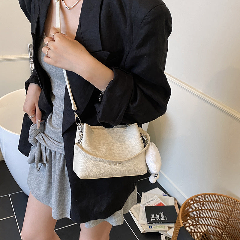 Foreign trade advanced sense bucket bag 2025 summer new niche design light daily commuting hand carry messenger bag