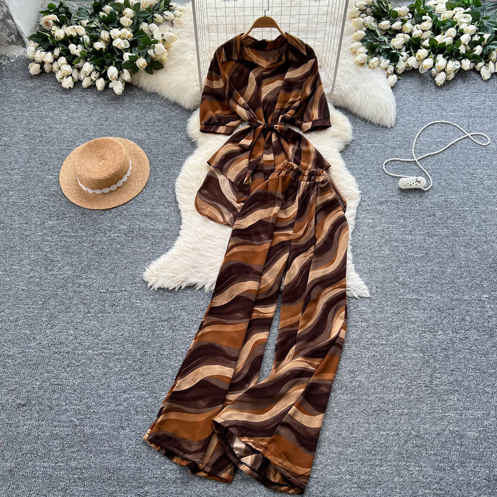 European style fashion print set - women's summer chic: tie-waist asymmetrical blouse & high-waisted wide-leg straight pants
