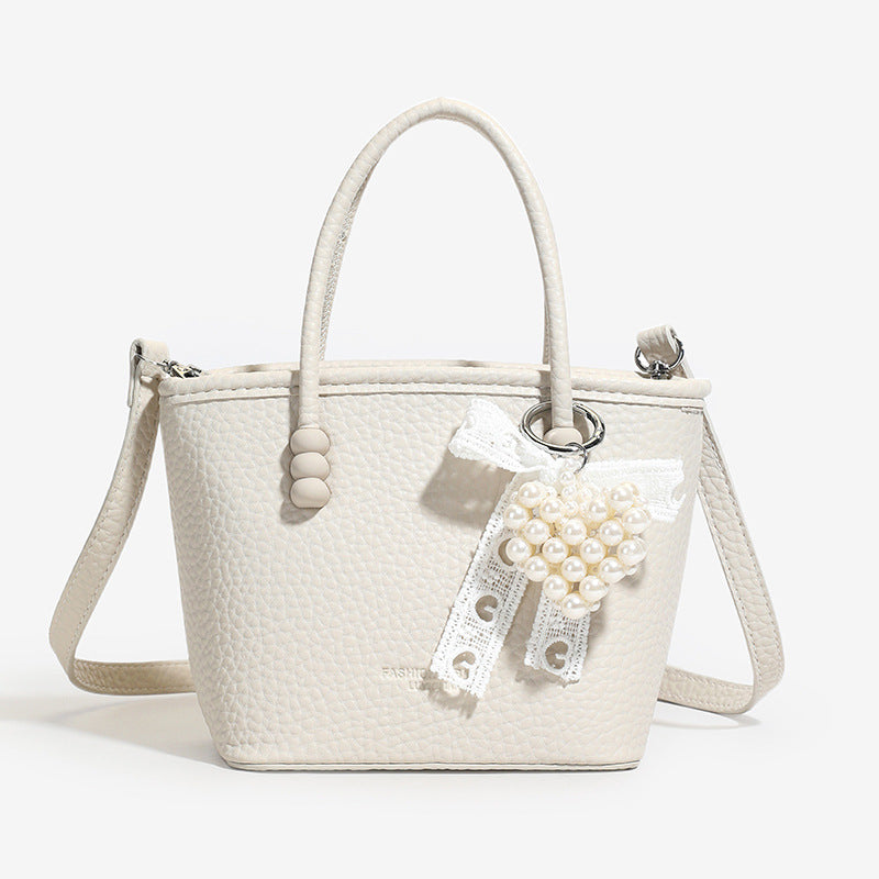 High sense fashion simple portable bucket bag women's 2025 spring and summer new casual simple solid color shoulder messenger bag