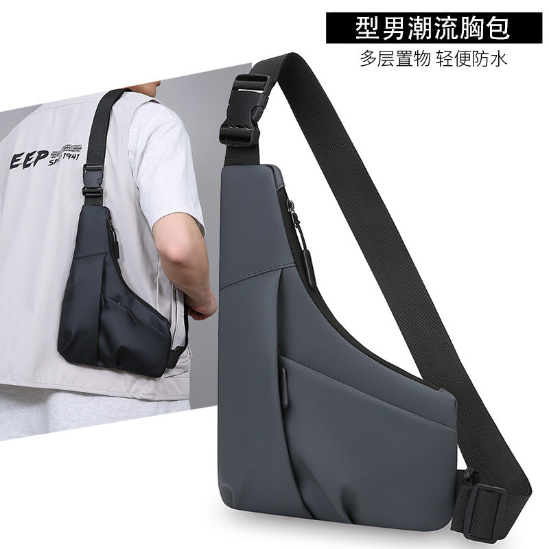 New men's light and close-fitting triangular bag, simple leather film texture shoulder messenger bag, trendy and cool casual portable breast bag
