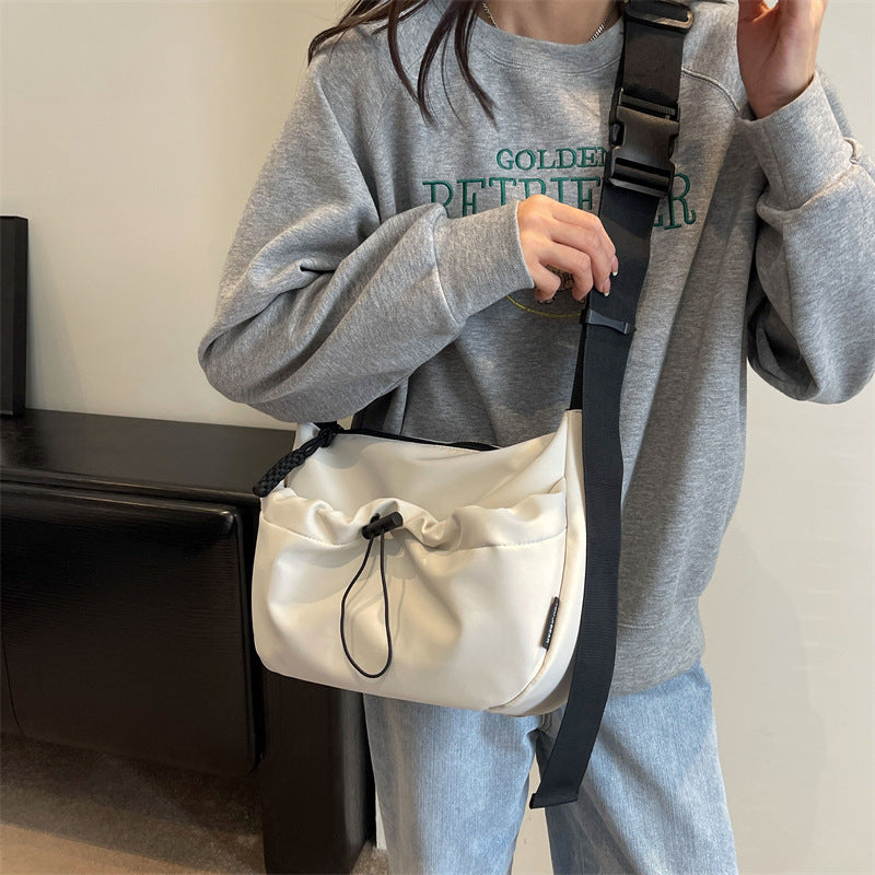 Cross-border special supply of solid color Oxford cloth messenger bag casual cloth bag 2024 new drawstring wide shoulder strap shoulder bag