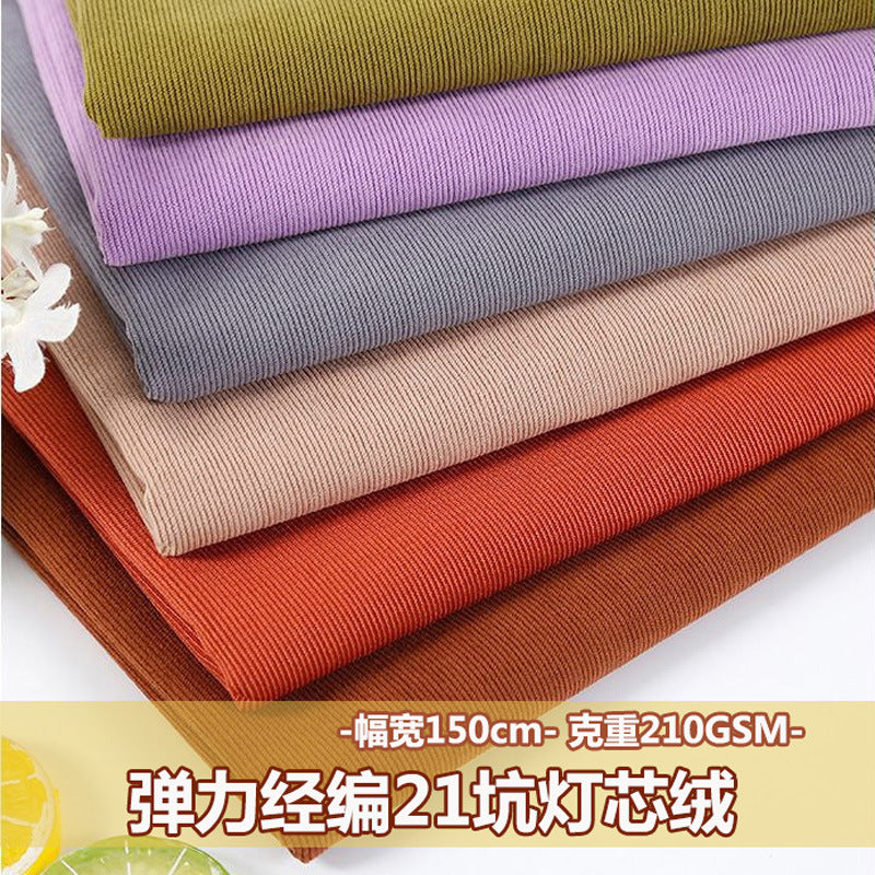Warp knitted elastic 21 corduroy fabric 21 pit thin polyester corduroy luggage sofa throw pillow clothing fabric