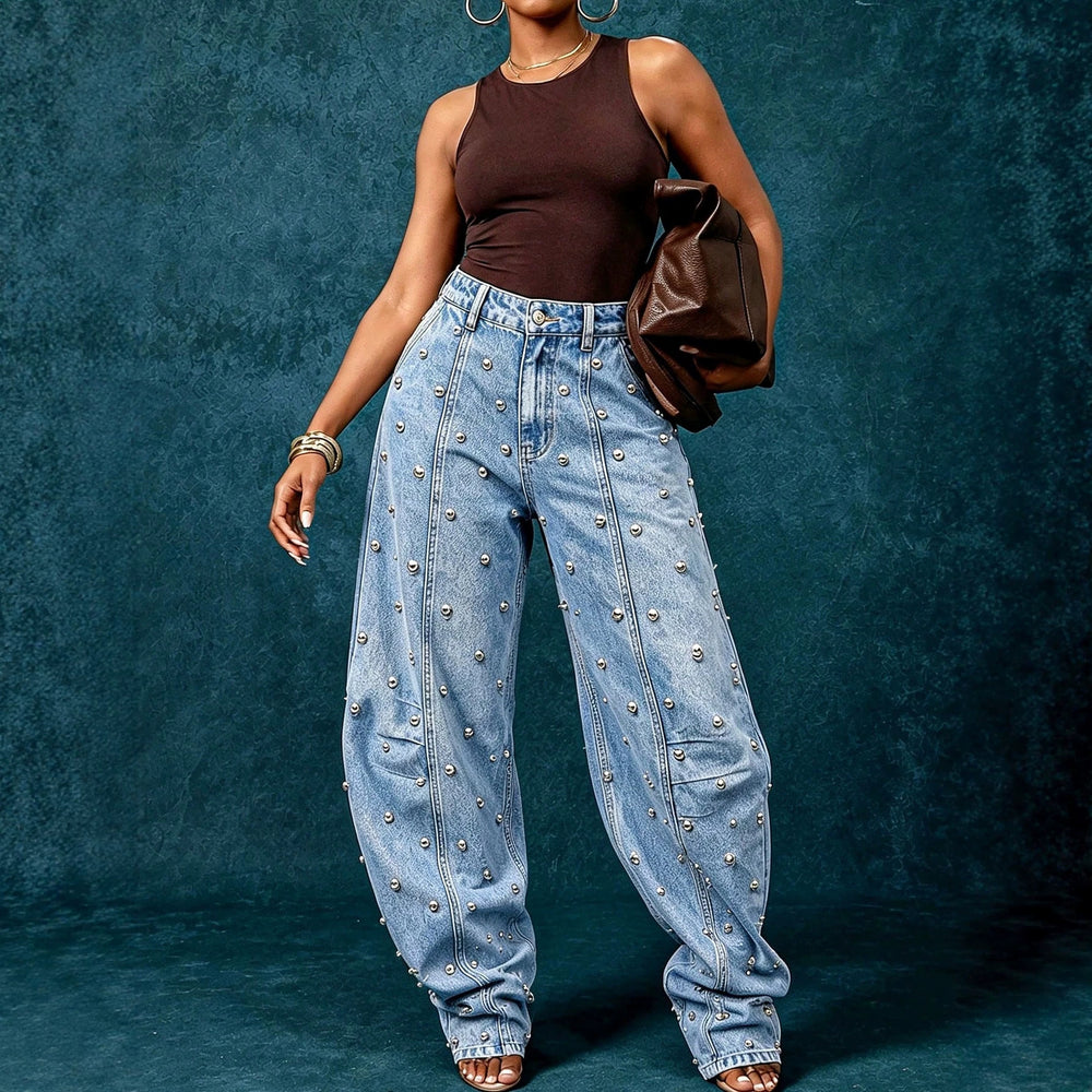European and american style women's washed denim jeans with metal rivet embellishments, high waist, split seam detail, relaxed fit, and wide leg design