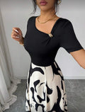women's v-neck a-line dress with cinched waist, black and white abstract print, and metal buckle detail – elegant and versatile