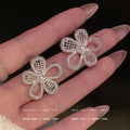Silver needle korean style lace design hollow flower s family pearl stud earrings women's high-end earrings elegant stud earrings