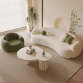 Curved, uniquely shaped, cream-toned sofa – a creative and sophisticated addition to clothing stores, beauty salons, office break rooms, and reception areas