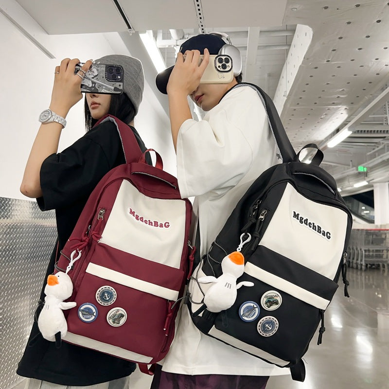 Large capacity casual backpack schoolbag male and female high school junior high school student schoolbag primary school student college student wholesale