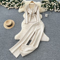 European chic: elegant and high-end strappy waist blazer-style knit top with high-waisted wide-leg pants