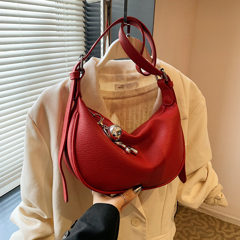 Cross-border niche soft leather lychee pattern portable dumpling bag women's 2025 new high-end fashion shoulder messenger bag