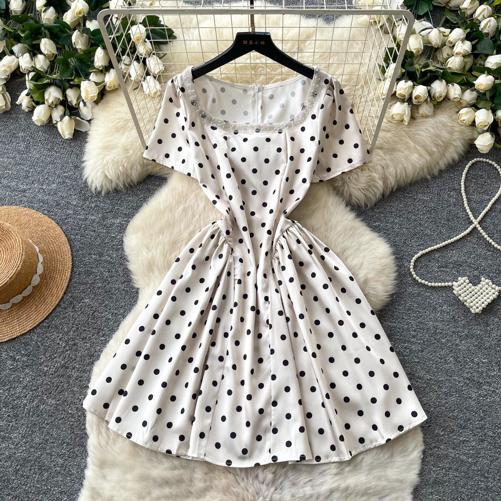 French chic polka dot dress - effortless summer style: square neck, cinched waist, slimming a-line for petite figures