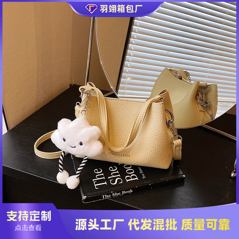 Foreign trade advanced sense bucket bag 2025 summer new niche design light daily commuting hand carry messenger bag