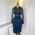 French-inspired, niche long-sleeved striped denim dress with a collared neckline, metal button detailing, a fitted waist, and a stylish slit