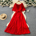 French-inspired pleated dress for women, featuring a bow tie, off-the-shoulder design, tie-waist, and flattering pleats for an elegant and sophisticated look