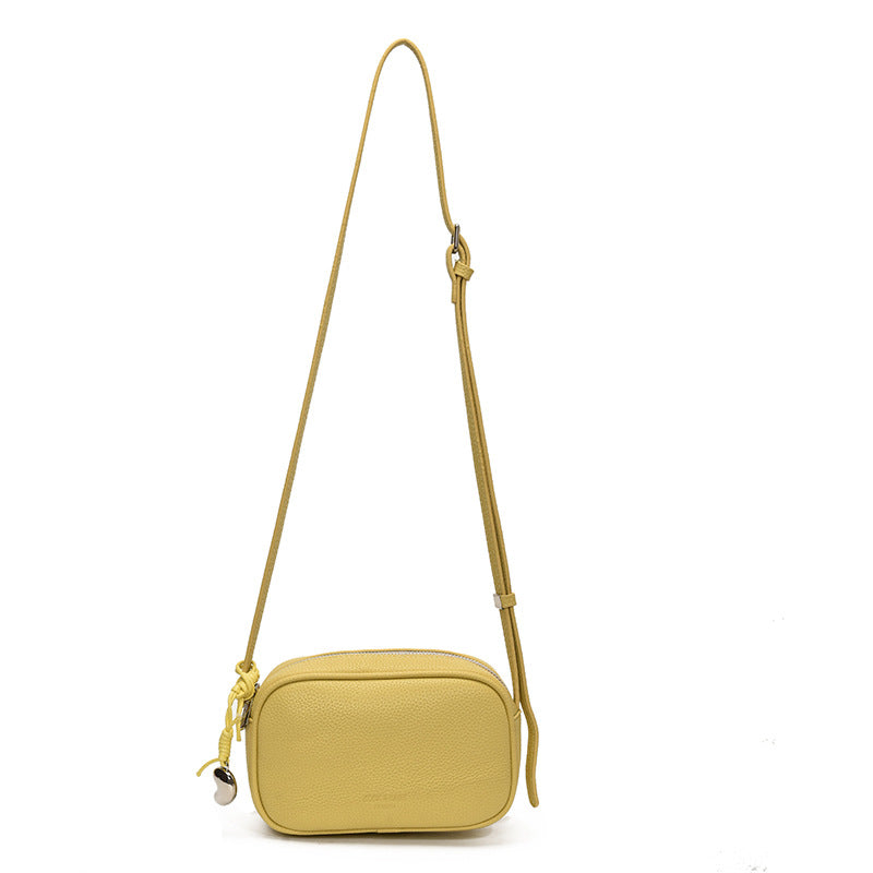 Cross-border high-end fashion foreign-style pillow bag women's 2025 new lychee pattern simple solid color shoulder messenger bag