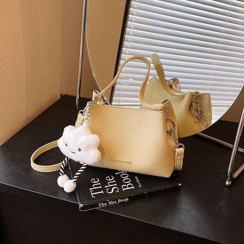 Foreign trade advanced sense bucket bag 2025 summer new niche design light daily commuting hand carry messenger bag
