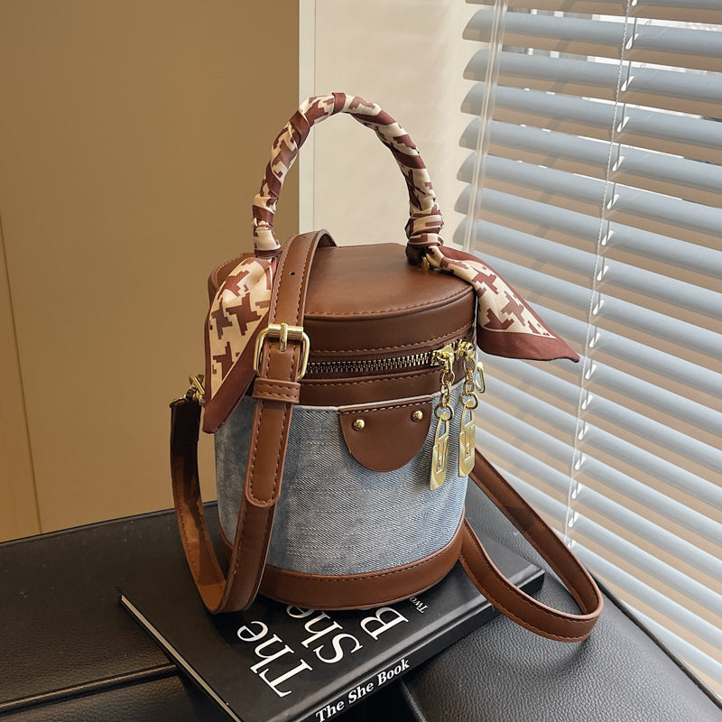 Retro contrasting color bucket bag women's 2025 new niche design portable cylinder bag versatile texture shoulder messenger bag