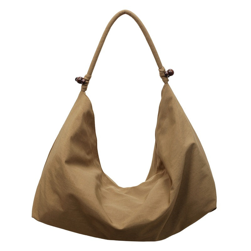 Simple and stylish large-capacity tote bag for women, a trendy new arrival for autumn and winter. perfect as a fabric bag for travel, leisure, and everyday use, or as a shoulder bag