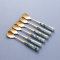 Dark green gold spoon