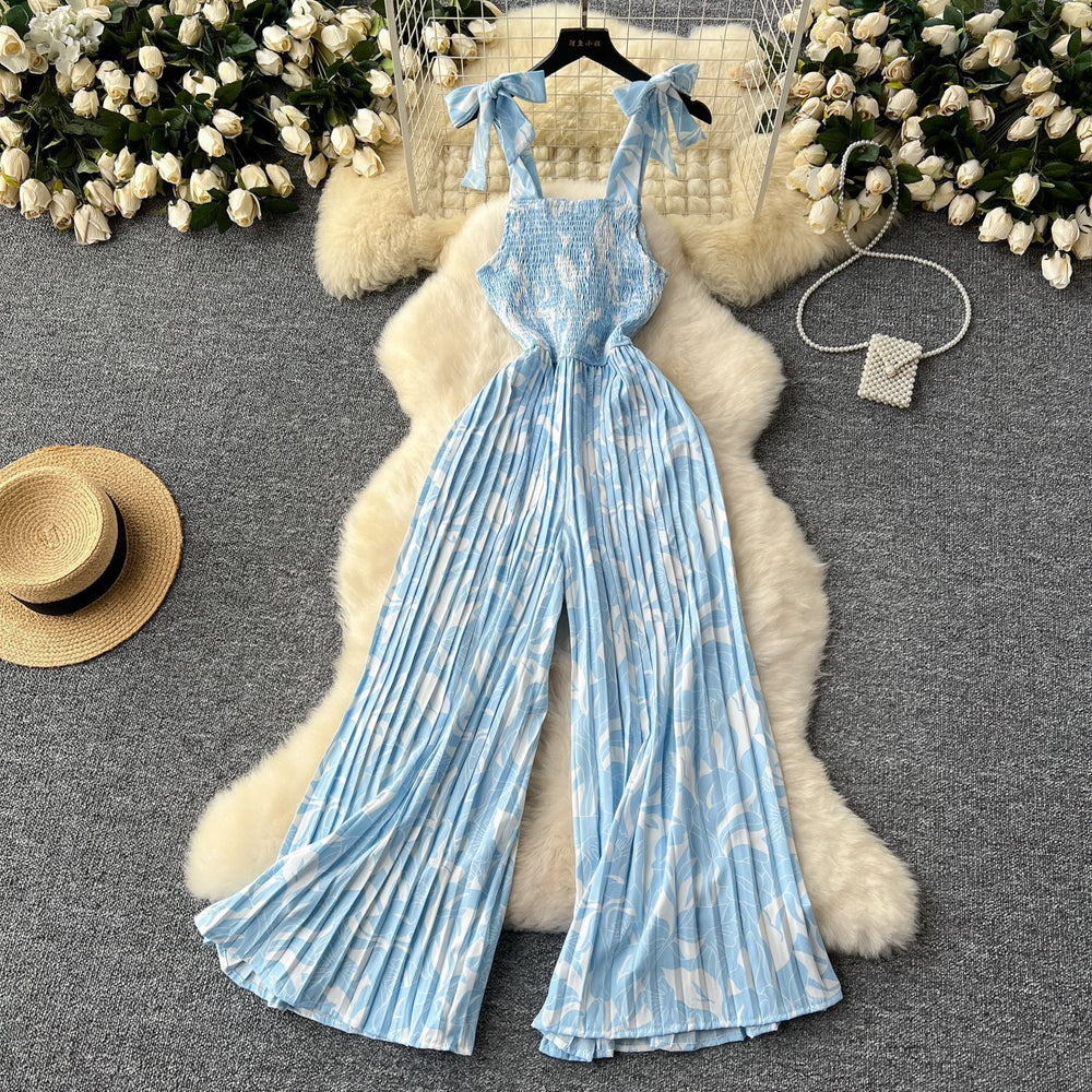 Women's summer jumpsuit for travel & vacation: stretchy, ruched, cinched waist, floral print, spaghetti strap, wide leg, long pants, beachwear