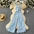 Women's summer jumpsuit for travel & vacation: stretchy, ruched, cinched waist, floral print, spaghetti strap, wide leg, long pants, beachwear