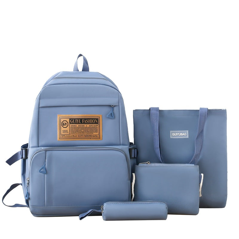 New primary and junior high school student schoolbag portable make-up bag four-piece Korean version simple backpack trendy campus backpack