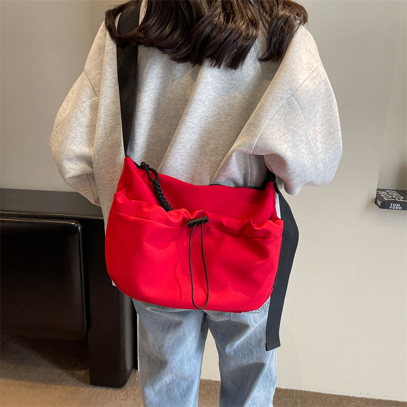 Cross-border special supply of solid color Oxford cloth messenger bag casual cloth bag 2024 new drawstring wide shoulder strap shoulder bag