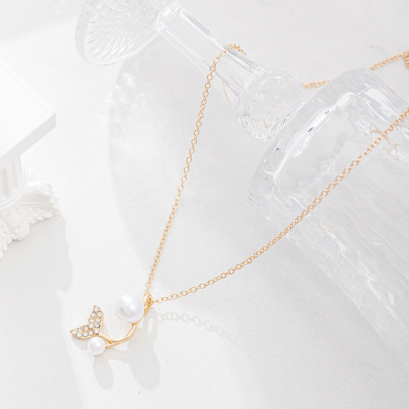 European and american cross-border e-commerce new jewelry: autumn/winter fashion pearl cross pendant versatile diamond-encrusted fishtail necklace for women
