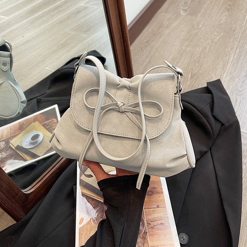 Solid color versatile bow small square bag women's bag 2025 new fashion simple shoulder bag foreign style portable commuter bag