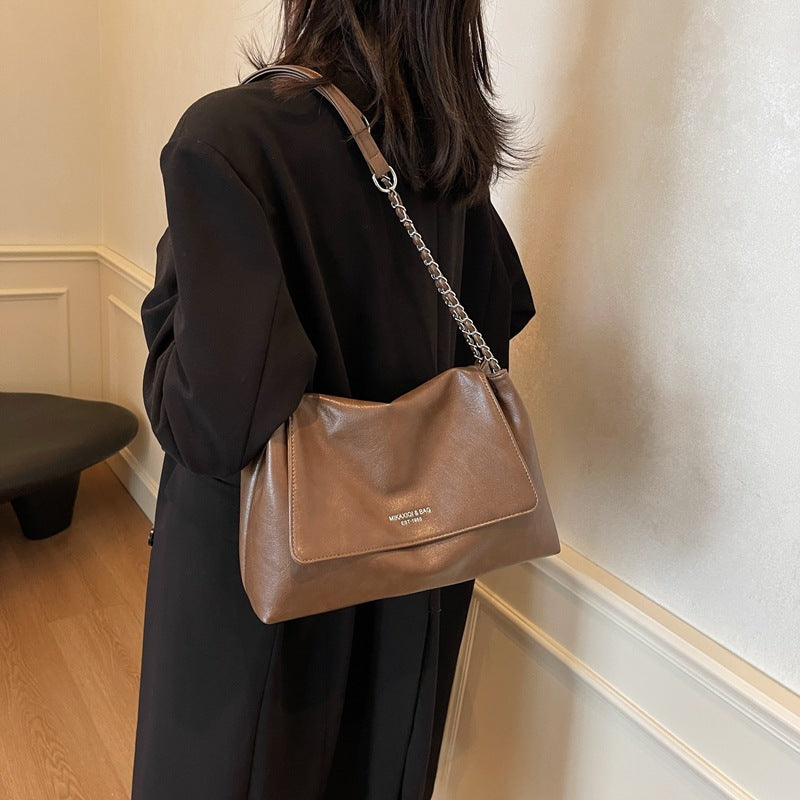 Solid color simple large-capacity foreign gas bag women's 2025 new trendy underarm commuter chain single shoulder tote bag
