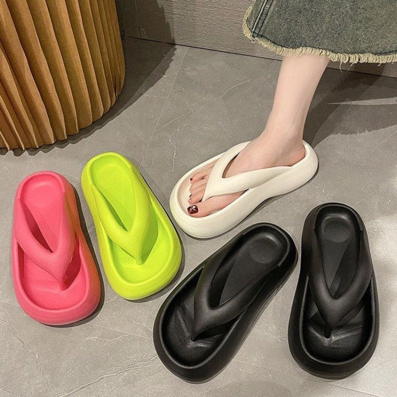 Flip-flops women's summer fashionoutwear2026new arrivalthick sole stepping on shit pure color seaside beach flip-flops summer