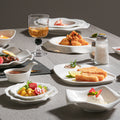 Minimalist pure white ceramic dinnerware set for home, restaurant, and hotel use - porcelain plates, creative plating, and dessert bowls
